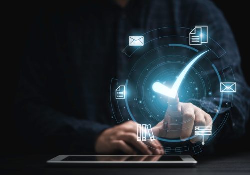 Businessman,Holding,Tablet,With,Virtual,Document,And,Mark,Correct,Sign